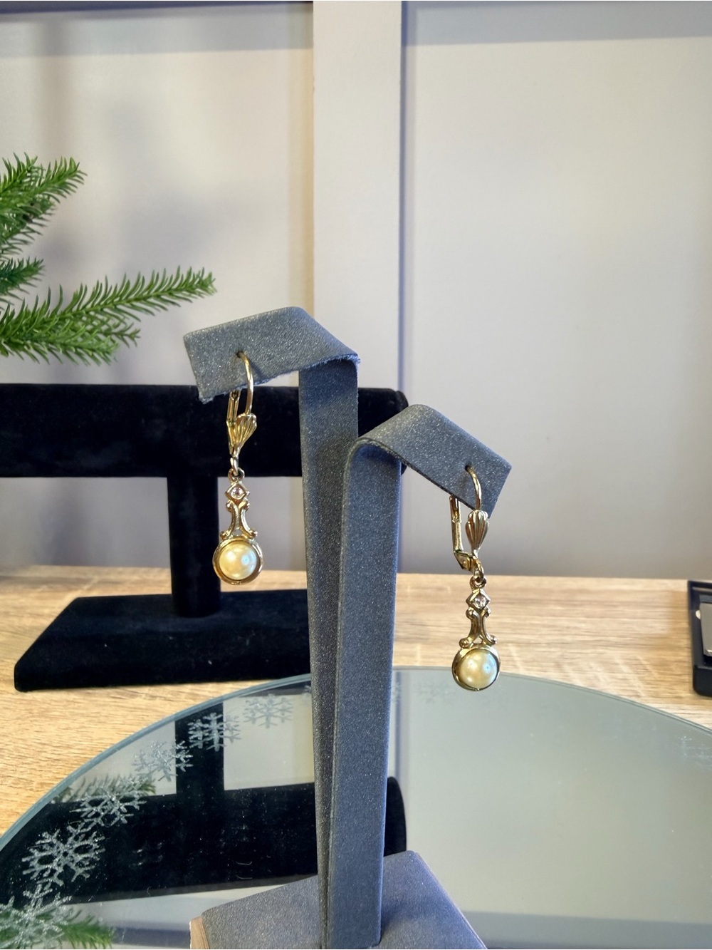 Vintage Victorian-style dangle earrings feature white pearls
